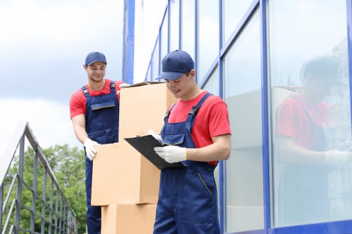 Commercial removal vehicle loading office furniture in central London