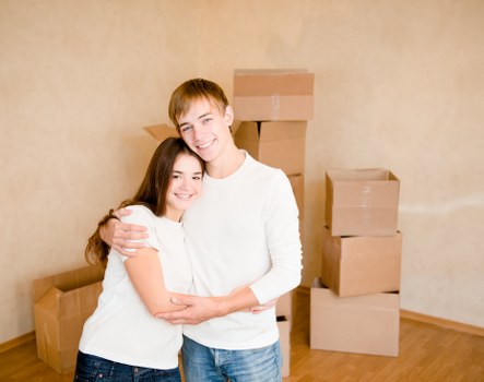 Careful loading of household items into a removals van