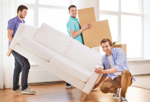 Packed office equipment and furniture ready for a Westminster business move