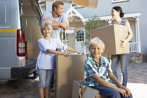 Professional movers handling furniture and boxes for a Westminster home removal