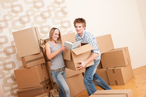 Professional moving team handling boxes and furniture in a Westminster flat